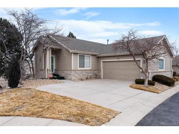 Charming single-story home with well-maintained lawn and attached two-car garage at 9567 Brentwood Way # A, Broomfield, CO 80021