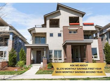 Modern two-story home with a combination of neutral stucco and brick exterior and well-maintained landscaping at 4535 W 50Th Ave, Denver, CO 80212