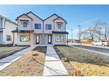 Charming two-story townhome with modern design elements and inviting front yard at 4101 S Lincoln St, Englewood, CO 80113