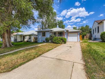 Charming single-story home with a well-maintained front yard and a long driveway at 1856 S Steele St, Denver, CO 80210