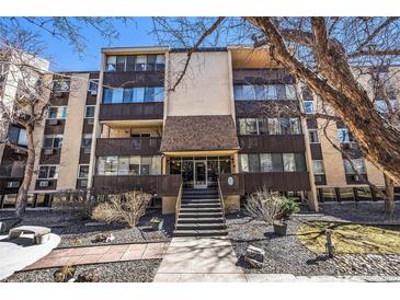 Charming condominium complex featuring a well-maintained facade and inviting entrance at 7040 E Girard Ave # 104, Denver, CO 80224