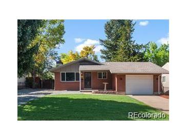 Charming ranch-style home with a well-manicured lawn and a cozy, inviting entrance at 4585 S Elati St, Englewood, CO 80110