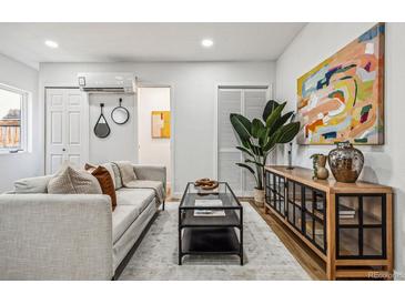 Bright living room with hardwood floors, modern furnishings, and stylish decor at 20 1/2 S Sherman St, Denver, CO 80209