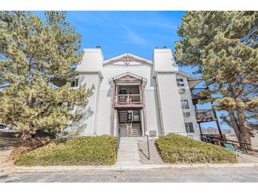 Exterior of charming multi-Gathering home with balconies and professionally landscaped front yard at 17493 E Mansfield Ave # 1231L, Aurora, CO 80013