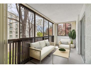 Enclosed balcony with seating and view at 3470 S Poplar St # 102, Denver, CO 80224