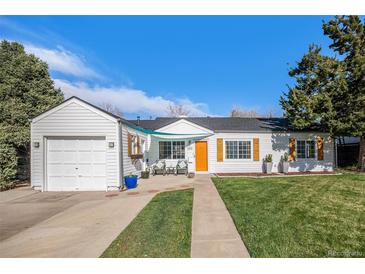 Charming ranch-style home featuring a well-maintained lawn and inviting curb appeal at 3350 S Forest St, Denver, CO 80222