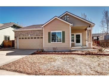 Charming single-Gathering home with a well-manicured lawn and attached two-car garage at 152 Pelican Ave, Brighton, CO 80601