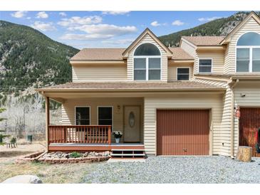 Charming two-story townhouse with covered porch and attached garage in a mountain setting at 1795 Mountain Creek Dr, Georgetown, CO 80444