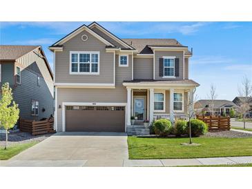 Charming two-story home with a well-manicured lawn and a two-car garage, perfect for Gathering living at 502 Green Mountain Dr, Erie, CO 80516