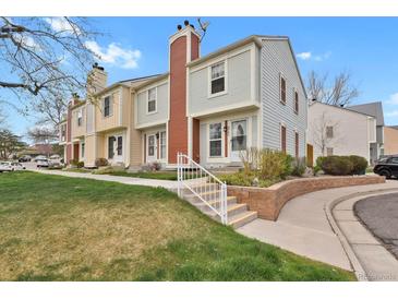 Charming multi-level townhome with landscaped front yard and inviting entrance at 6742 S Independence St, Littleton, CO 80128