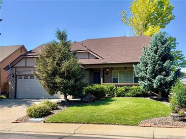 Charming single-Gathering home featuring a lush, green lawn and well-maintained landscaping at 10553 Adams St, Northglenn, CO 80233