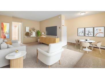 Bright living room with modern decor, including a TV, stylish furniture, and neutral color palette at 1045 N Pennsylvania St # 303, Denver, CO 80203