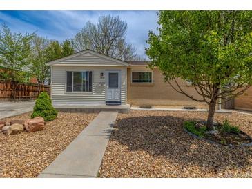 Charming home featuring a well-manicured front yard with easy access and drought-resistant landscaping at 7828 Florado St, Denver, CO 80221