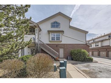 Inviting townhome featuring well-maintained landscaping, stairs to unit entry, and convenient parking at 3010 W Prentice Ave # J, Littleton, CO 80123