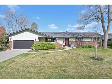 Charming single-story home with brick accents, a well-maintained lawn, and an attached two-car garage at 4152 S Vrain St, Denver, CO 80236