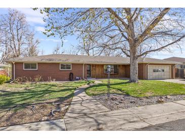 Charming brick ranch-style home with a well-maintained lawn and mature trees at 5432 E Bails Dr, Denver, CO 80222