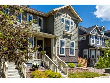 Charming two-story home with well-maintained landscaping, inviting front porch and beautiful architectural details at 17706 Cherokee St, Broomfield, CO 80023
