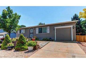 Charming single-story home with well-maintained landscaping and an attached one car garage at 6120 W 111Th Ave, Westminster, CO 80020