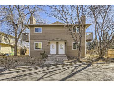 Two-story exterior of a home featuring a wooden facade, dual entryways and small balconies on the second floor at 4529 Barnacle Ct, Boulder, CO 80301