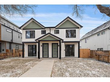 Modern duplex with white siding, black trim, green accents, and inviting curb appeal at 2430 Ames St, Edgewater, CO 80214