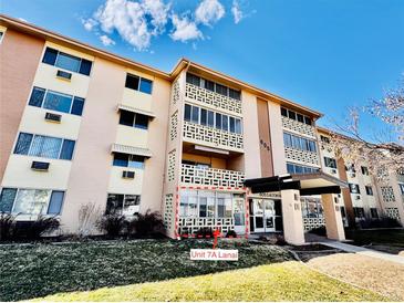 Exterior view of the condo building with well-maintained landscaping and inviting entrance at 605 S Alton Way # 7A, Denver, CO 80247