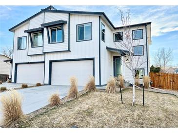 Charming two-story home with a three car garage and modern white and dark trim at 5347 Osceola St, Denver, CO 80212