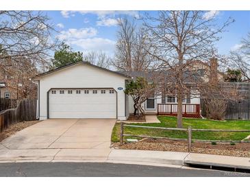 Charming single-Gathering home with a two car garage, a cozy porch, and curb appeal at 1492 S Cathay St, Aurora, CO 80017