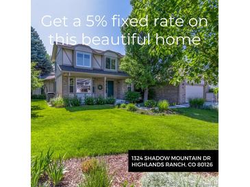 Charming two-story home featuring a well-manicured lawn and mature trees in a residential neighborhood at 1324 Shadow Mountain Dr, Highlands Ranch, CO 80126
