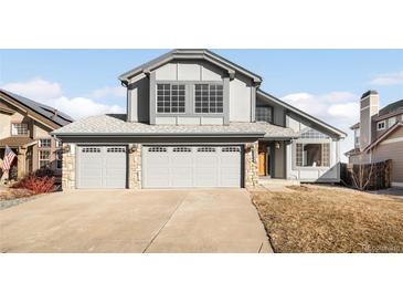 Two-story home with a three-car garage and well-maintained landscaping at 9053 W 103Rd Ave, Broomfield, CO 80021