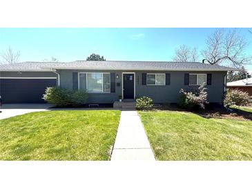 Charming single-story home featuring a well-manicured lawn and a welcoming front entrance at 3461 S Ivy Way, Denver, CO 80222