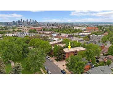 Stunning aerial view of a building complex and Denver skyline, showcasing the vibrant city and location at 3050 W 32Nd Ave # 202C, Denver, CO 80211