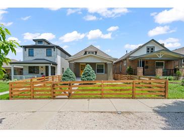 Charming home featuring a well-maintained front yard and classic architectural details at 3320 N Columbine St, Denver, CO 80205