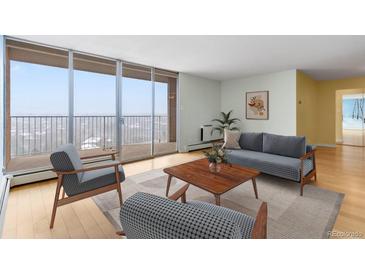 Bright living room with large windows, balcony access, and stylish furnishings. Ready to relax and enjoy the view! at 955 Eudora St # 1106, Denver, CO 80220