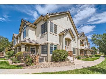 Charming townhome with a landscaped front and lovely curb appeal in a well-maintained community at 22580 E Ontario Dr # 202, Aurora, CO 80016