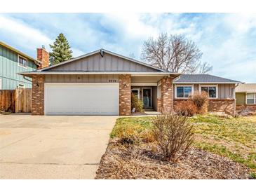 Charming single-story brick home with a two-car garage and well-maintained front yard at 8970 Garland Ct, Westminster, CO 80021