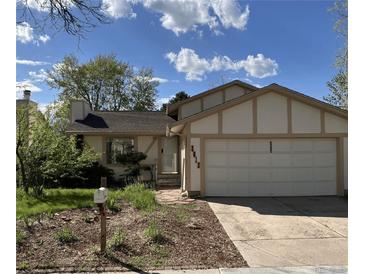 Charming single-Gathering home with a well-maintained front yard and an attached two-car garage at 3613 S Olathe St, Aurora, CO 80013
