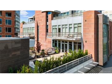 View of a multilevel balcony featuring modern furniture and landscaping at 2800 E 2Nd Ave # 202, Denver, CO 80206