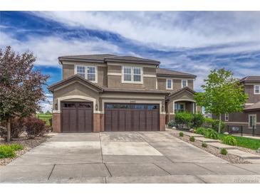 Beautiful two-story home featuring a large three-car garage, landscaped yard, and a traditional design at 27625 E Moraine Dr, Aurora, CO 80016