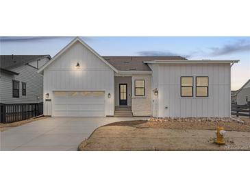 Charming single-Gathering home with a 2-car garage and modern farmhouse-style facade at 11442 Autumn Moon St, Littleton, CO 80125