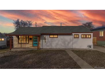 Charming single-story home featuring a colorful door and a well-maintained lawn under a beautiful sky at 1345 S Meade St, Denver, CO 80219