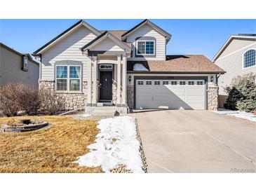 Charming two-story home with a well-maintained lawn and stone accents at 11363 Jersey St, Thornton, CO 80233