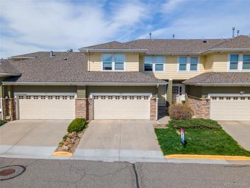 Inviting townhome with attached garage and meticulously maintained lawn at 3000 E 112Th Ave # 102, Northglenn, CO 80233