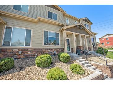 Inviting townhome with a charming entrance and well-maintained landscaping, enhancing its curb appeal at 1732 Aspen Meadows Cir, Federal Heights, CO 80260
