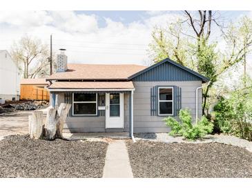 Charming bungalow with gray siding, a quaint front porch, and a well-maintained landscape at 4209 S Bannock St, Englewood, CO 80110