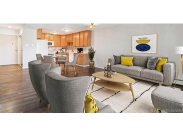 Bright, open-concept living space featuring hardwood floors and contemporary furnishings at 775 S Alton Way # 3C, Denver, CO 80247
