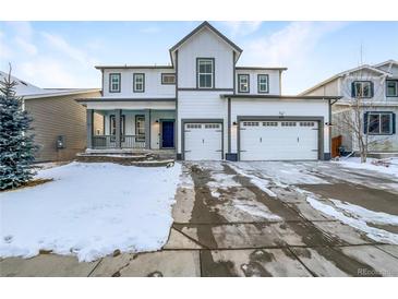 Charming two-story home with a three-car garage and inviting front porch at 339 Rocking Chair Dr, Berthoud, CO 80513