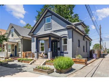 Charming gray two-story home with landscaped front yard and inviting porch at 1519 E 29Th Ave, Denver, CO 80205