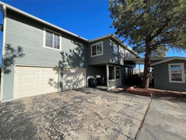 Two-story house with attached two-car garage and additional detached building at 12505 N 3Rd St, Parker, CO 80134