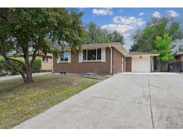 Charming brick home with a well-maintained front yard and a long driveway leading to a one-car garage at 3150 W Mexico Ave, Denver, CO 80219