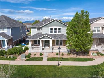 This home features well-manicured front lawn and inviting front porch at 9530 Gray St, Westminster, CO 80031